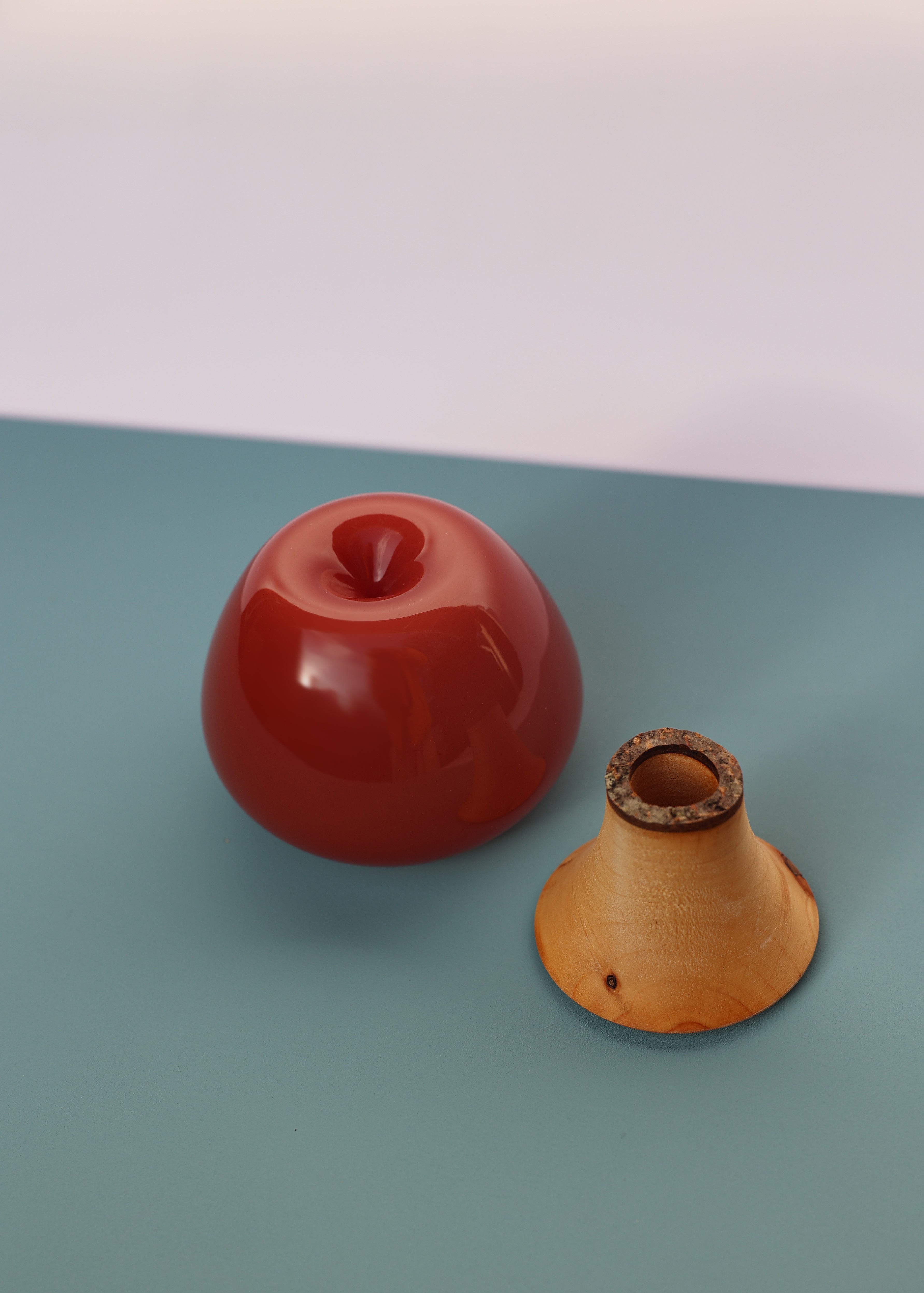 Apple Stacking Vessel Terracotta unstacked featuring a sleek and modern design, perfect for contemporary interiors.