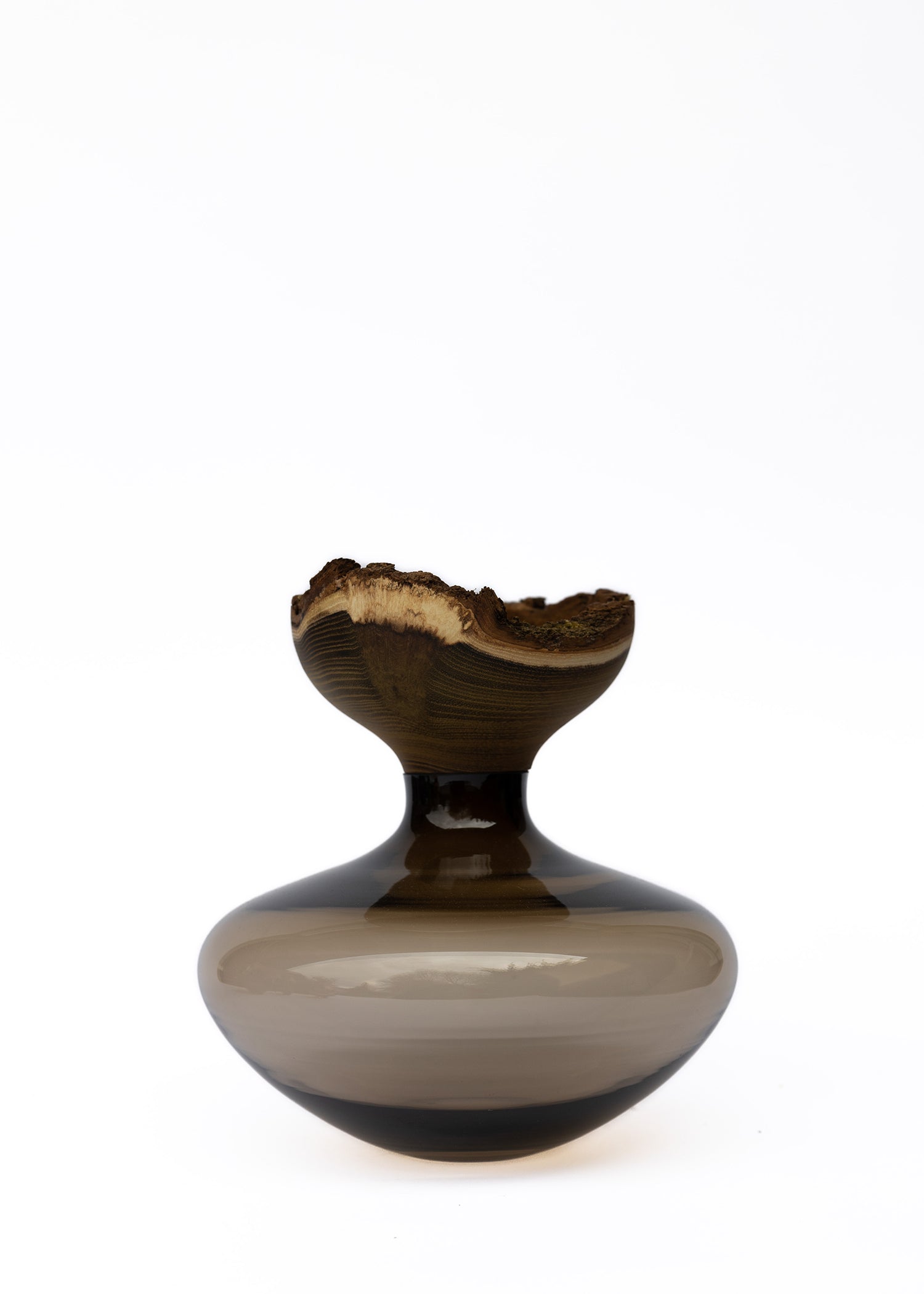 Bloom Stacking Vessel in Smoke, showcasing a smooth, sophisticated design with a smoky finish and elegant stacking form.