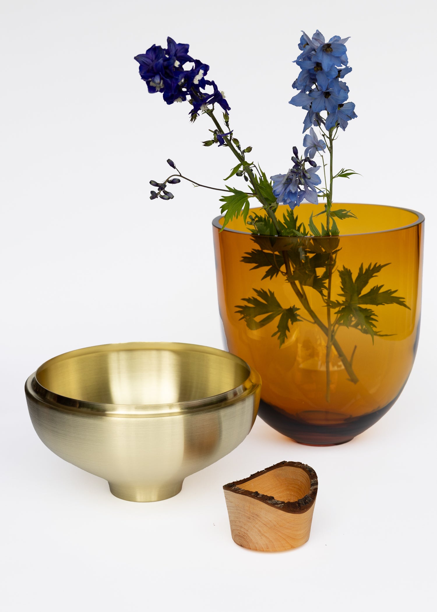 India Large I Stacking Vessel in Amber Unstacked with Flowers, showcasing a warm, golden hue that adds elegance and sophistication to any modern or traditional setting.