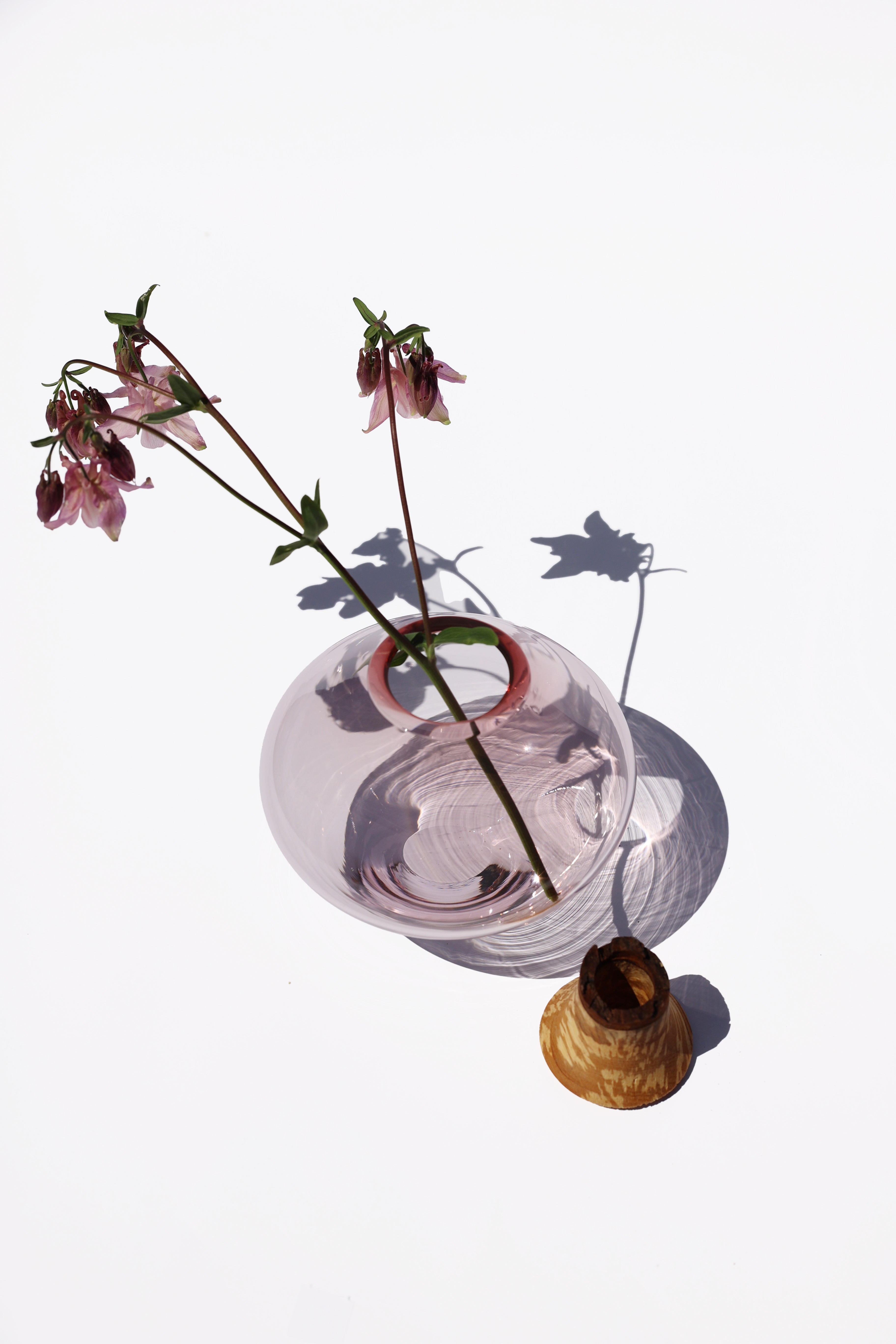 Matisse II Rose Stacking Vessel unstacked with flowers, highlighting the intricate design and elegant details.