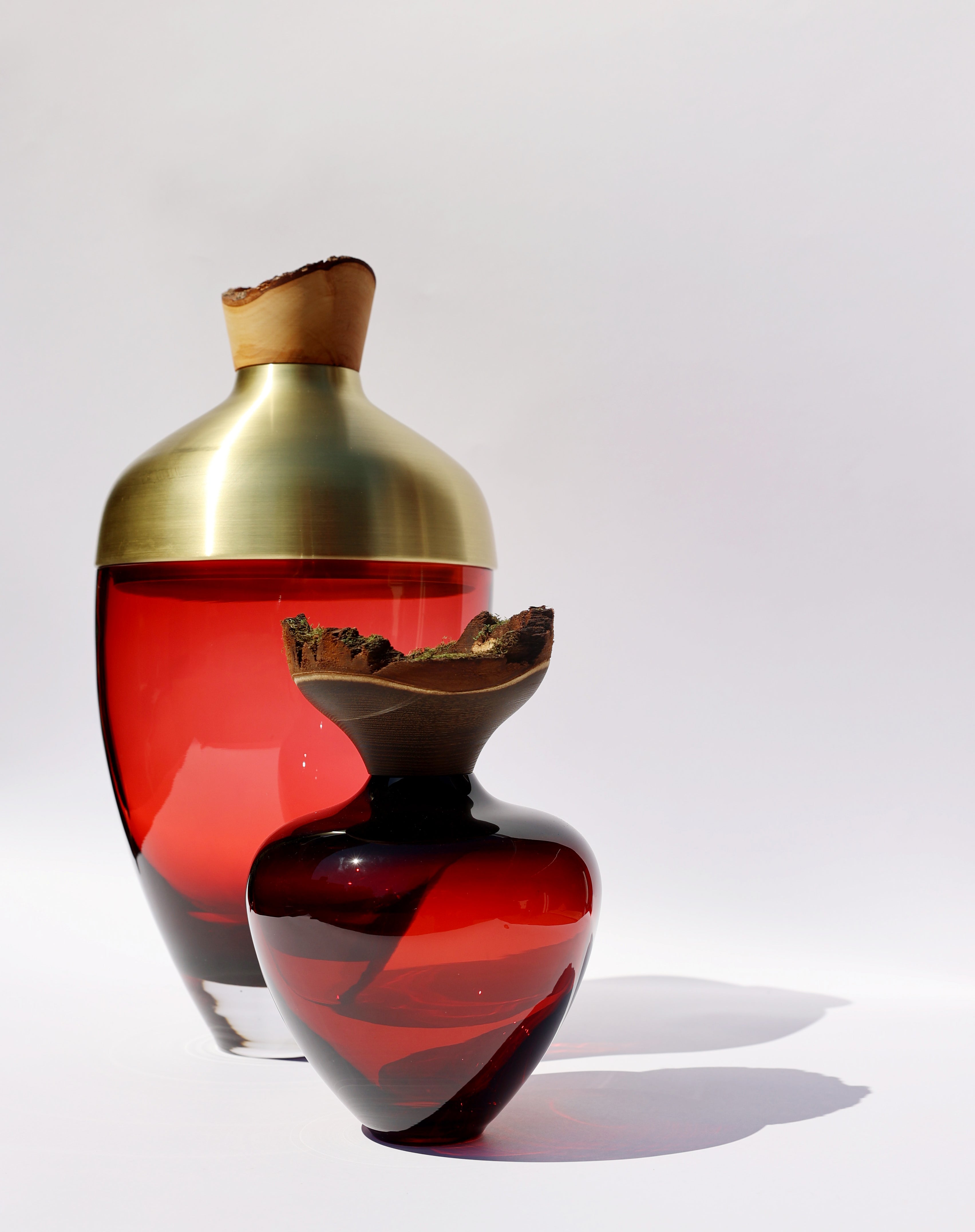 Nani Stacking Vessel in Red & Brass, combining bold red with a luxurious brass finish, creating a striking and elegant centerpiece for modern interiors.