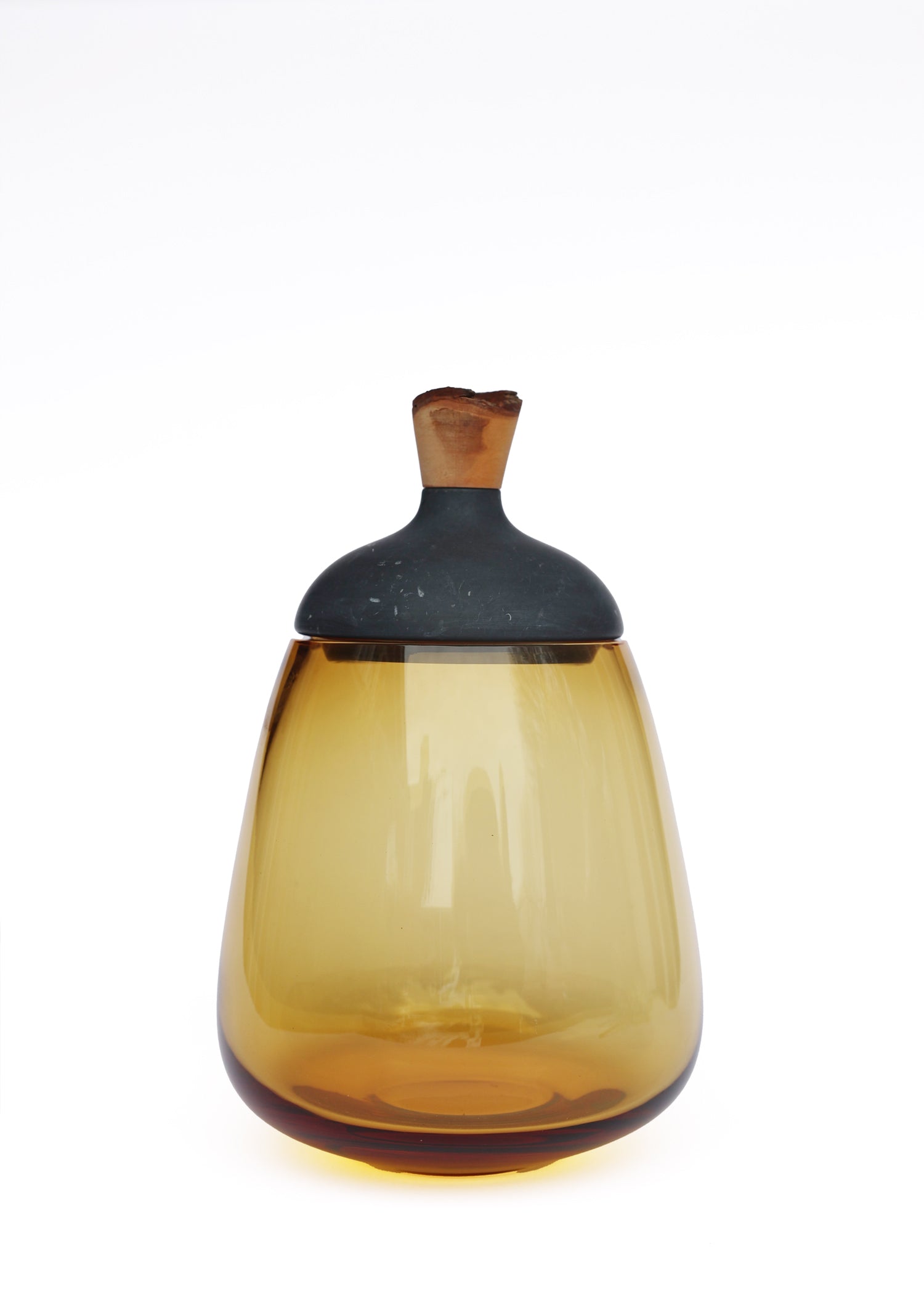 Terra Stacking Vessel in Black Marble Amber, featuring a striking contrast of textures and materials in a sculptural form.